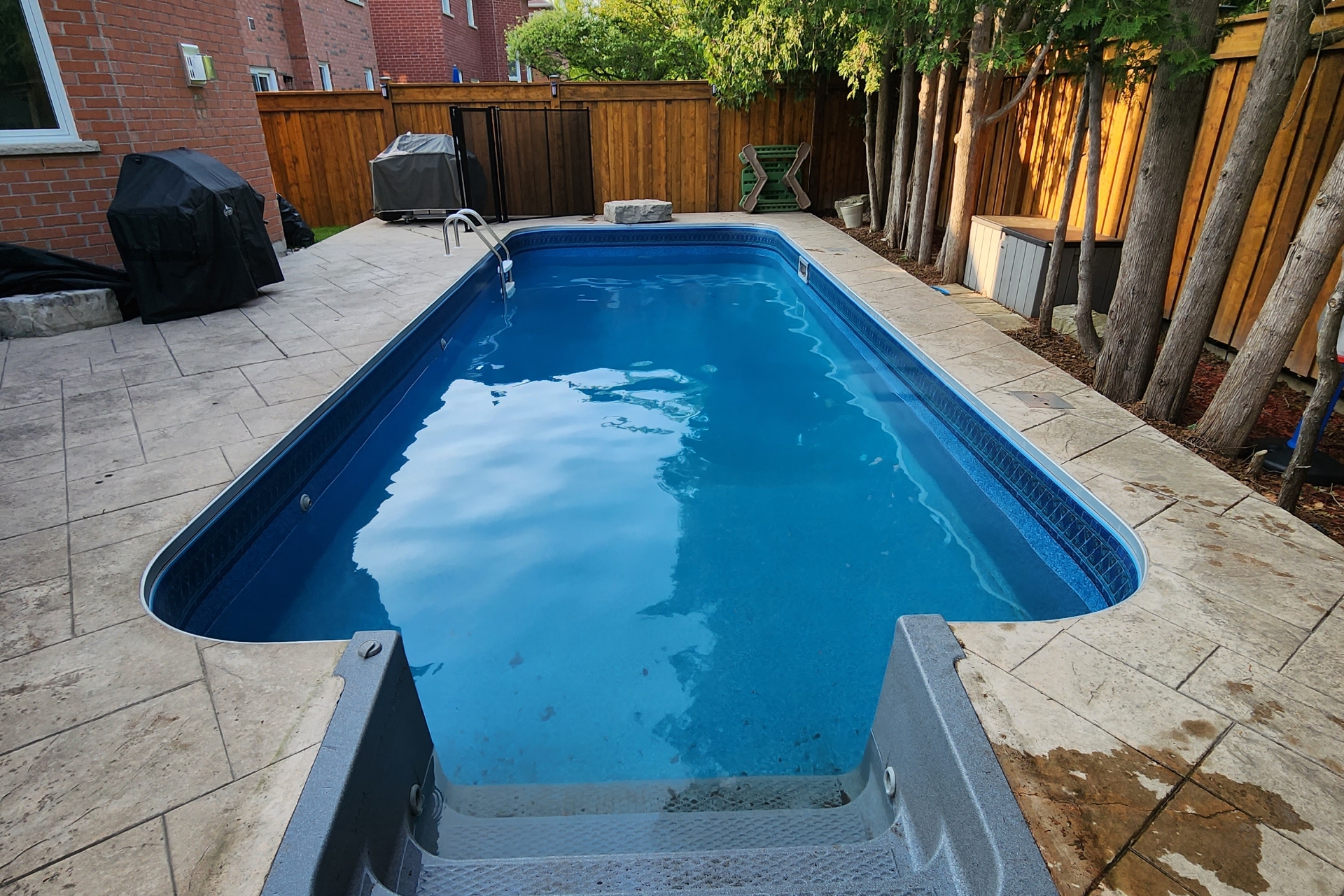 Backyard pool cleaning from Ontario Pool Services