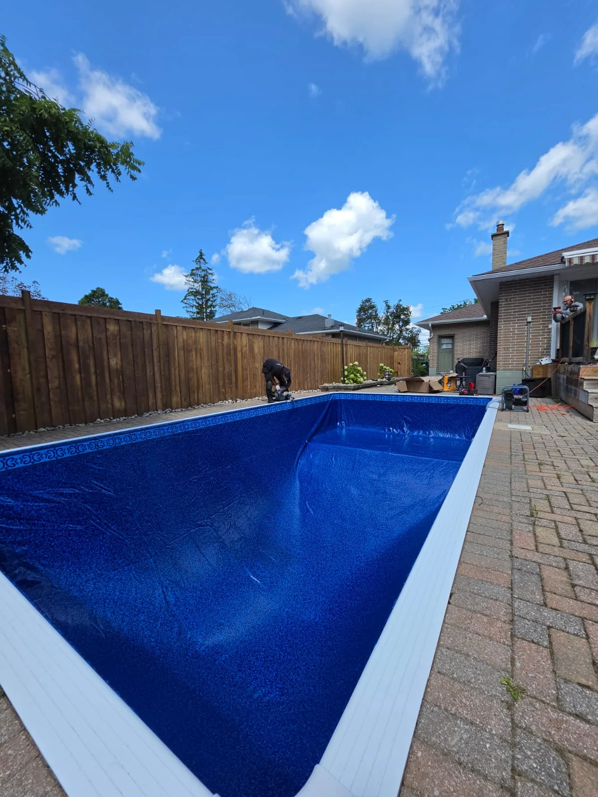 Blue patterned pool liner viewed from inside the pool